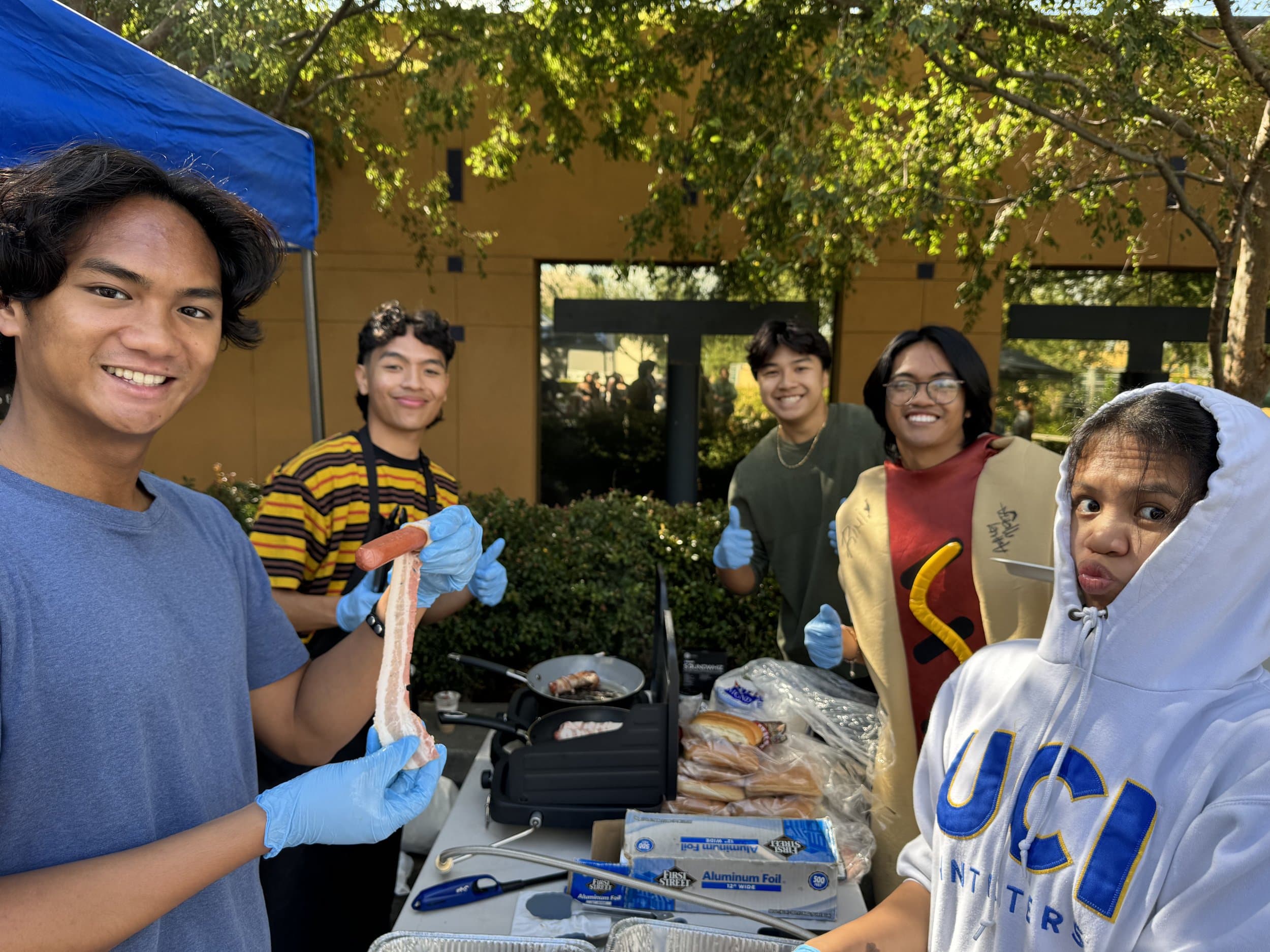 Members selling bacon-wrapped hot dogs